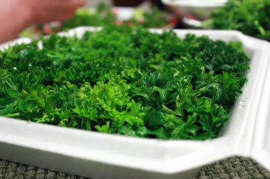 A completed presentation box constructed of parsley and lettuce.